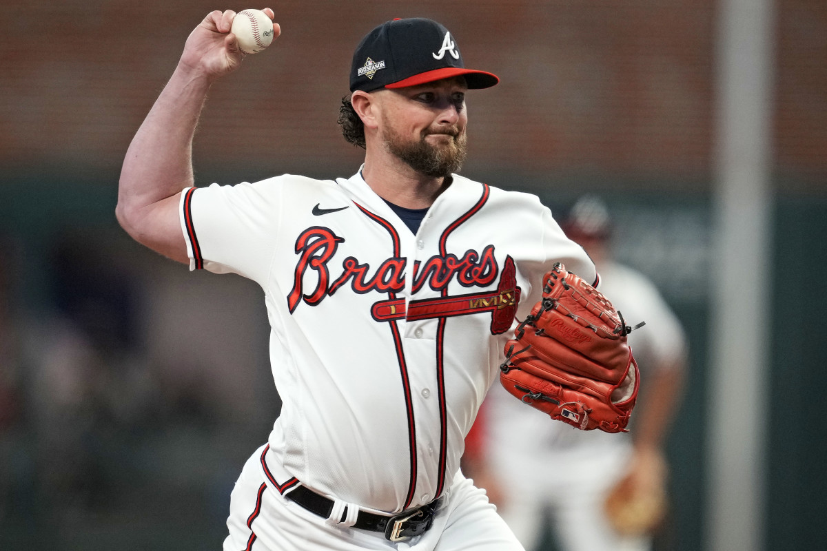 Oct 9, 2023; Cumberland, Georgia, USA; Atlanta Braves relief pitcher Kirby Yates (22) pitches during the fifth inning against the Philadelphia Phillies in game two of the NLDS for the 2023 MLB playoffs at Truist Park.